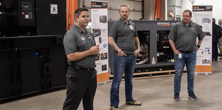 Three Generac employees presenting products and speaking