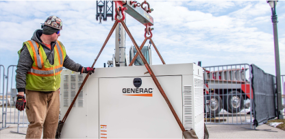 Image of an worker installing a Generac generator.