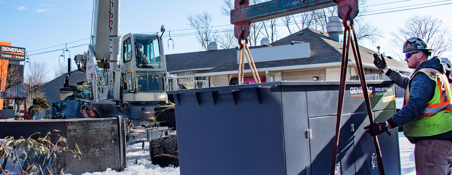 Image of a Generac partner installing a generator