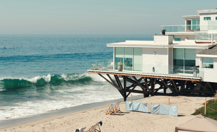 Home built on a beach next to ocean